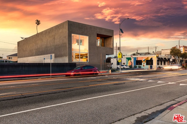 view of outdoor building at dusk