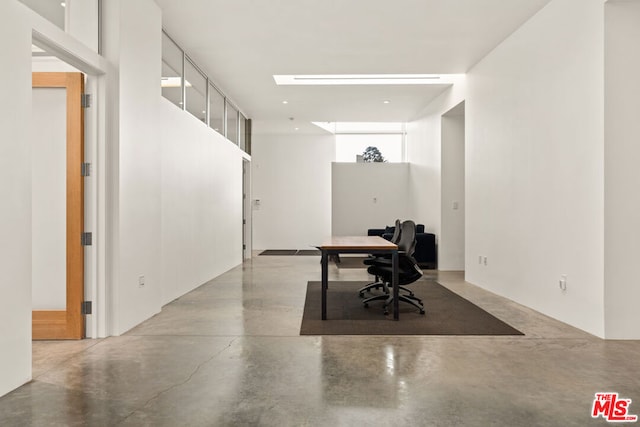 unfurnished office featuring concrete floors