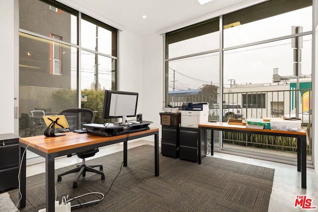 office area featuring floor to ceiling windows