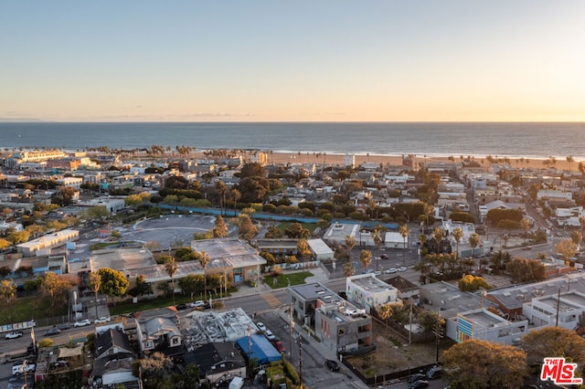 aerial view at dusk with a water view