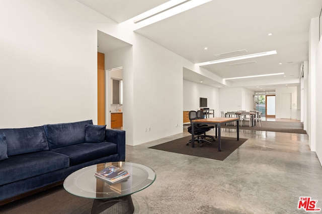 living room with concrete floors