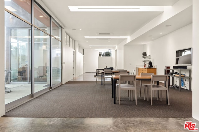 dining space featuring floor to ceiling windows and a healthy amount of sunlight