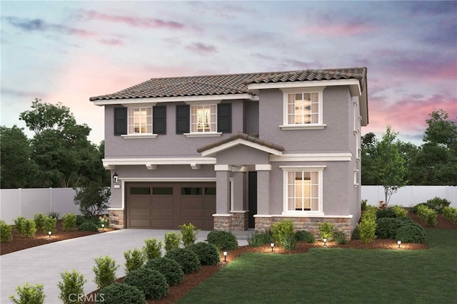 view of front of home with a yard and a garage