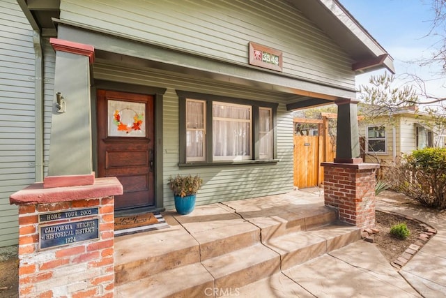 property entrance with covered porch