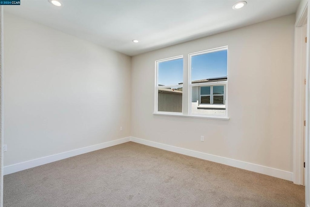 unfurnished room featuring carpet flooring