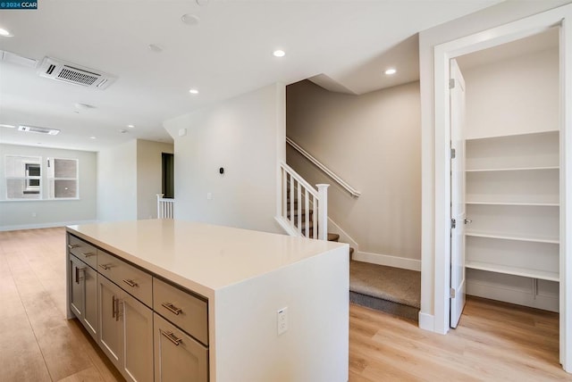 kitchen featuring light hardwood / wood-style floors and a kitchen island