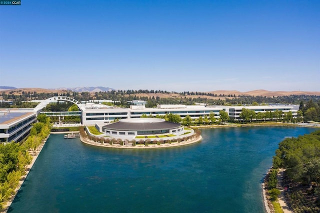 birds eye view of property featuring a water and mountain view