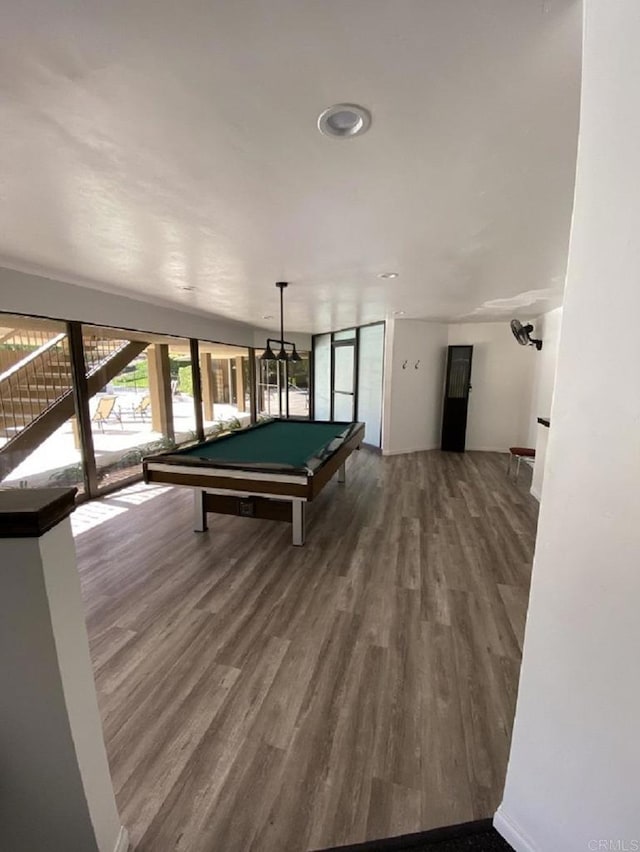 recreation room with hardwood / wood-style floors and pool table