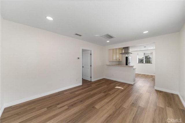 unfurnished living room featuring dark hardwood / wood-style floors