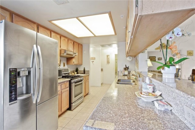 kitchen with light brown cabinets, light tile patterned floors, sink, and appliances with stainless steel finishes