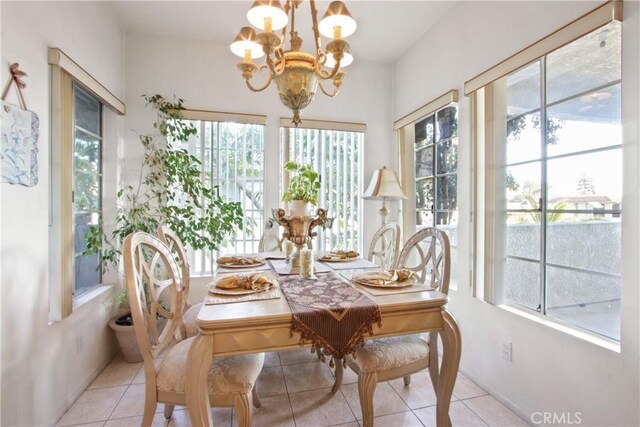 sunroom featuring a wealth of natural light and a chandelier