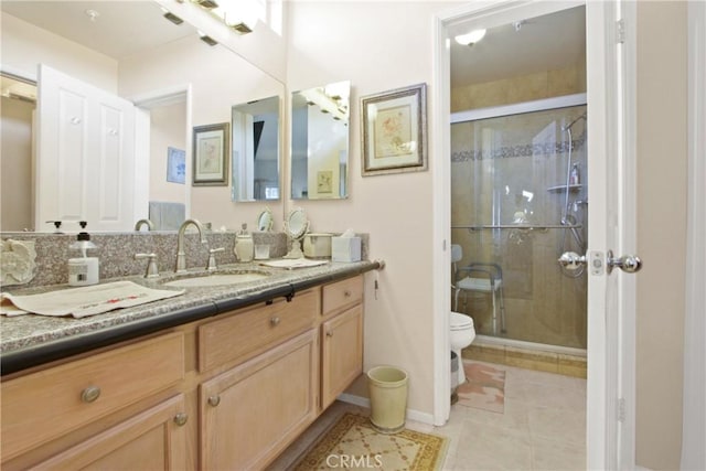 bathroom featuring toilet, tile patterned flooring, vanity, and walk in shower