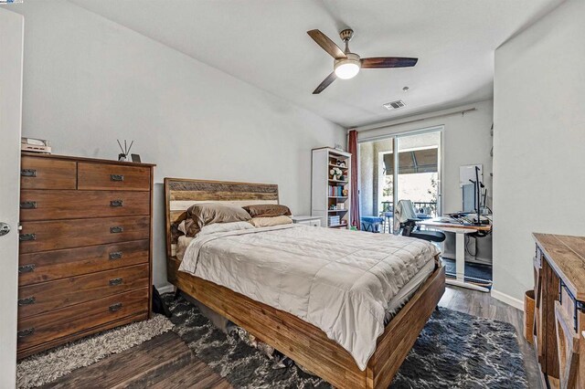 bedroom with dark wood-type flooring and ceiling fan