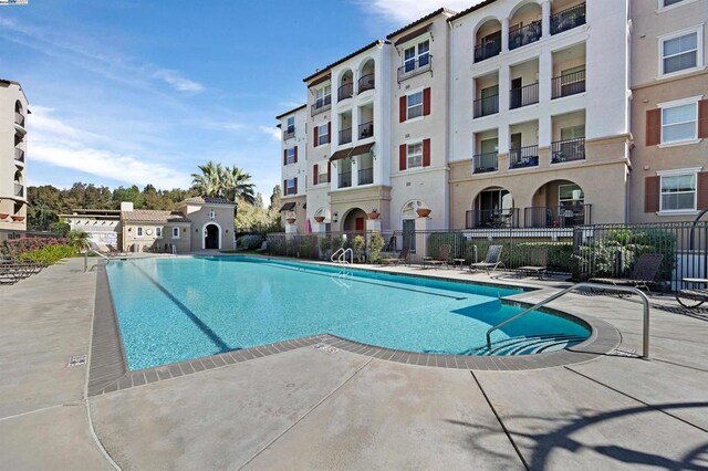 view of swimming pool with a patio area