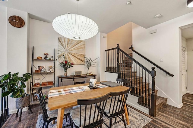 dining space featuring dark wood-type flooring