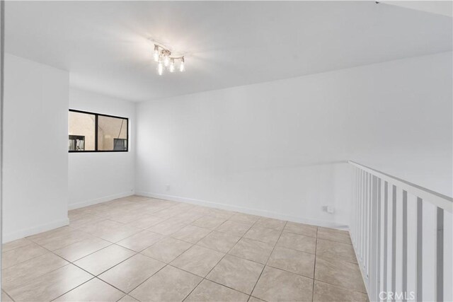 unfurnished room with light tile patterned floors