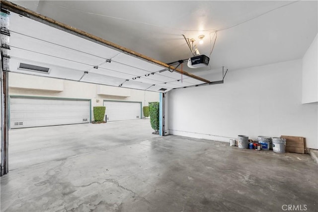 garage featuring a garage door opener