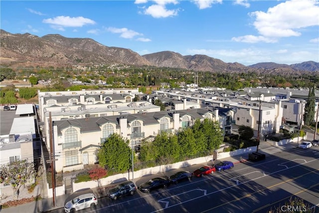 birds eye view of property with a mountain view