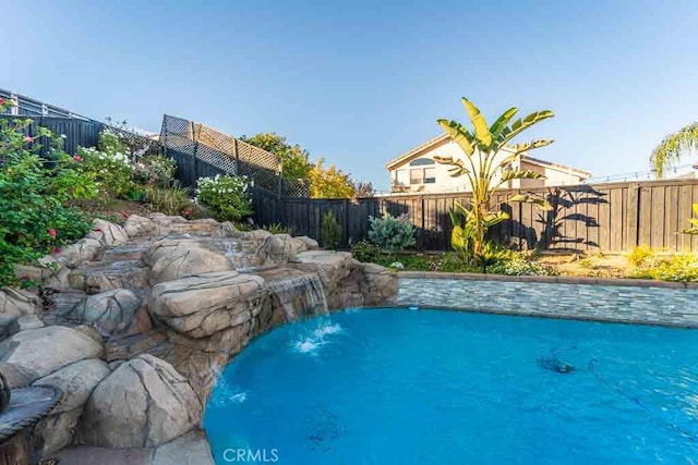 view of pool featuring pool water feature