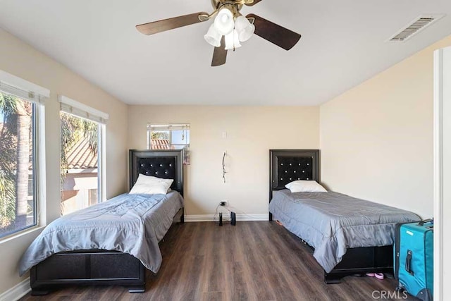 bedroom featuring dark hardwood / wood-style floors and ceiling fan