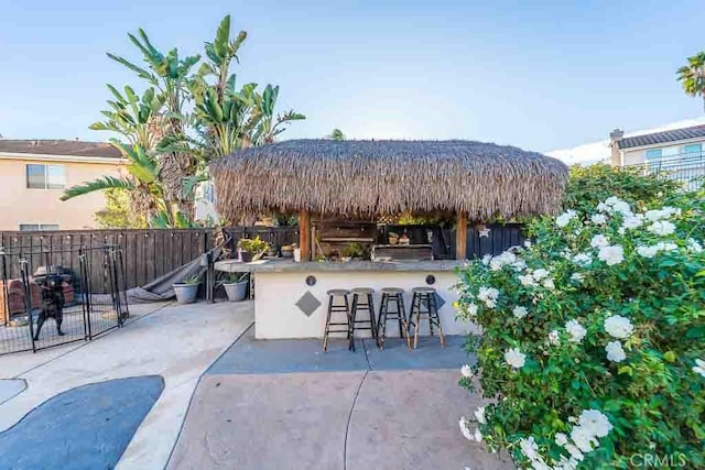 view of patio / terrace featuring an outdoor bar