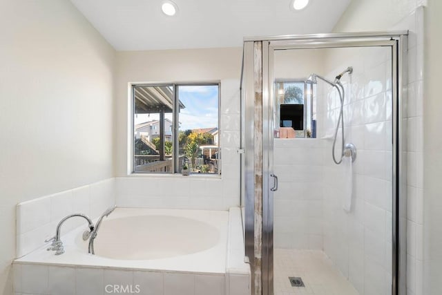 bathroom with separate shower and tub and vaulted ceiling