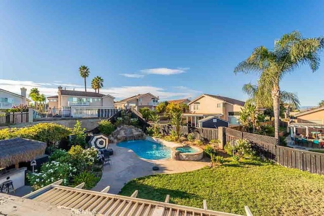 view of swimming pool with a patio area and an in ground hot tub