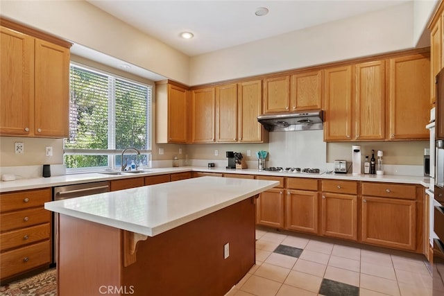 kitchen featuring dishwasher, sink, light tile patterned floors, white gas stovetop, and a kitchen island