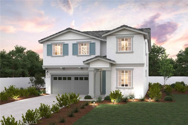 view of front of house featuring a yard and a garage