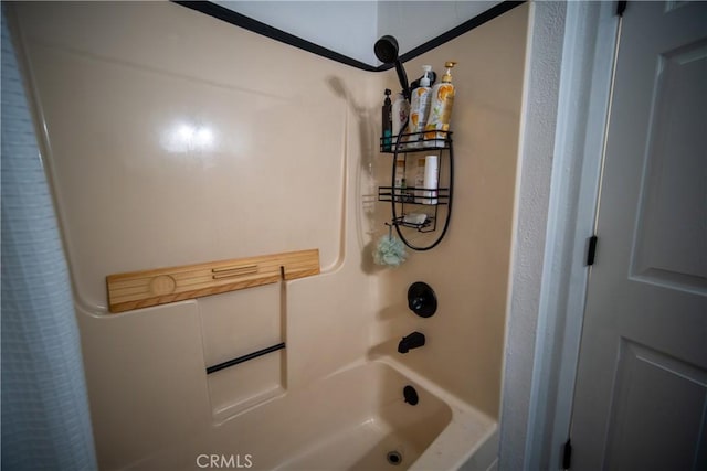 bathroom featuring shower / bath combo with shower curtain