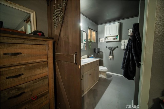 bathroom with toilet and vanity