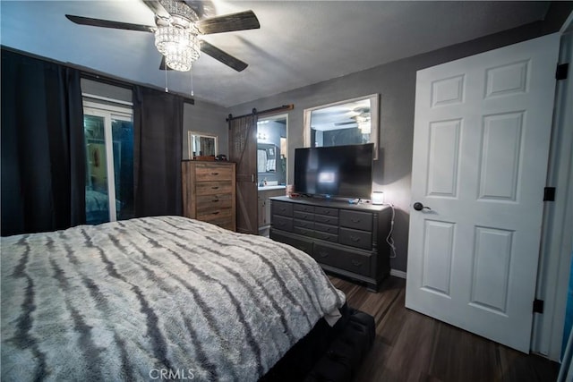 bedroom featuring access to outside, ensuite bath, ceiling fan, and dark hardwood / wood-style flooring