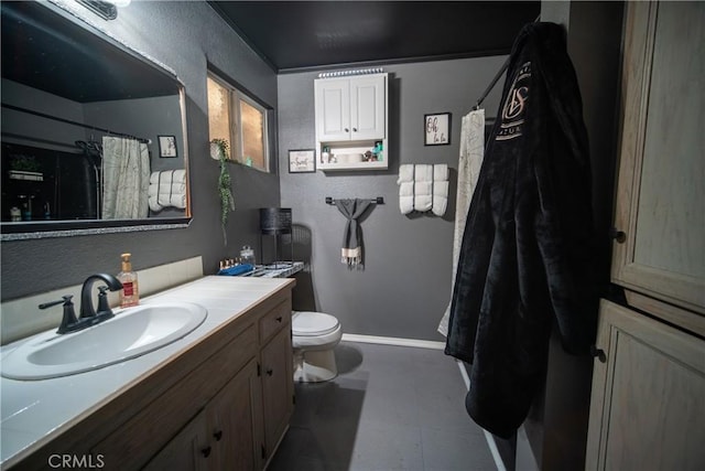 bathroom with toilet and vanity