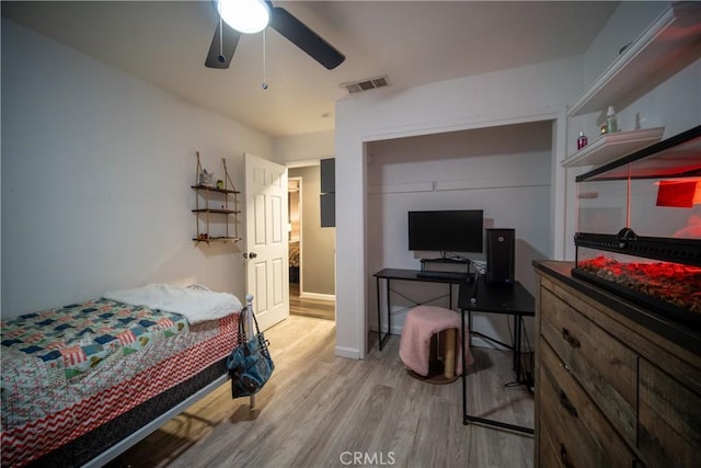 bedroom featuring a closet, ceiling fan, and hardwood / wood-style floors