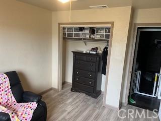 living area with hardwood / wood-style flooring