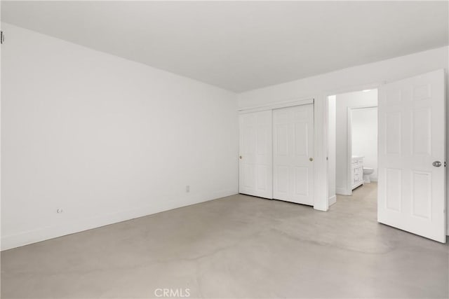 unfurnished bedroom with a closet