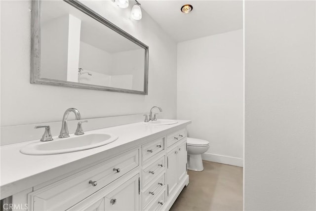 bathroom featuring vanity and toilet