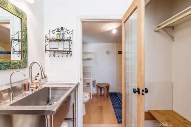 interior space featuring hardwood / wood-style flooring and sink