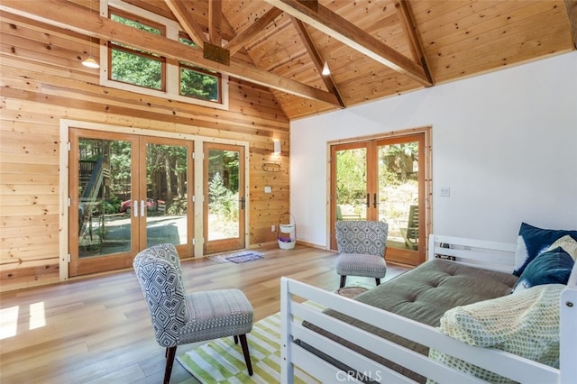 sunroom / solarium with french doors, vaulted ceiling with beams, and wood ceiling