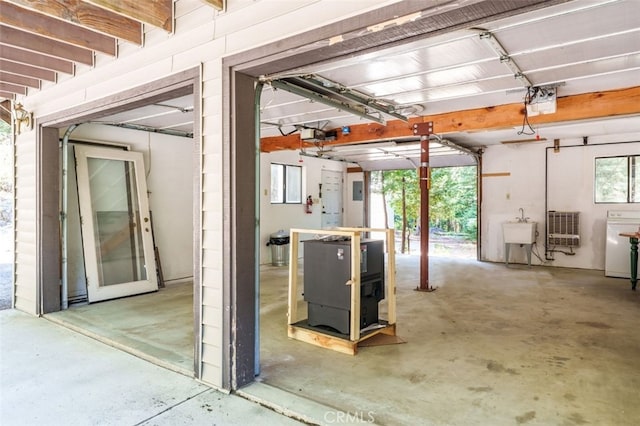 garage with sink and a garage door opener