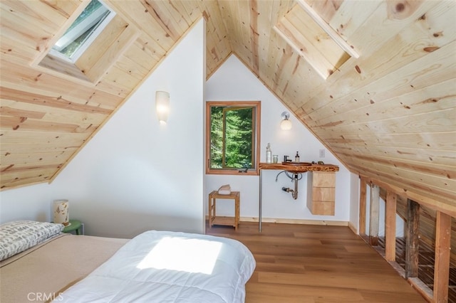 bedroom featuring wood ceiling, vaulted ceiling with skylight, and wood-type flooring