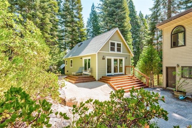 rear view of house featuring french doors