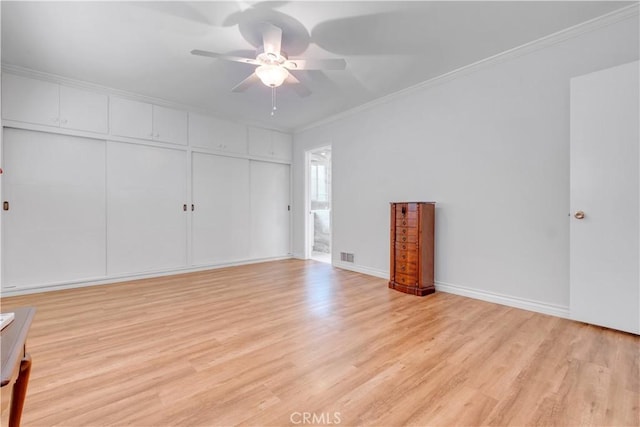 unfurnished living room with light hardwood / wood-style flooring, ceiling fan, and crown molding