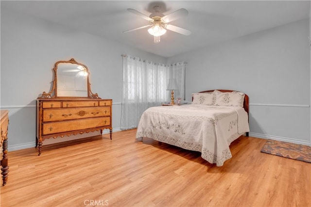 bedroom featuring ceiling fan and light hardwood / wood-style flooring