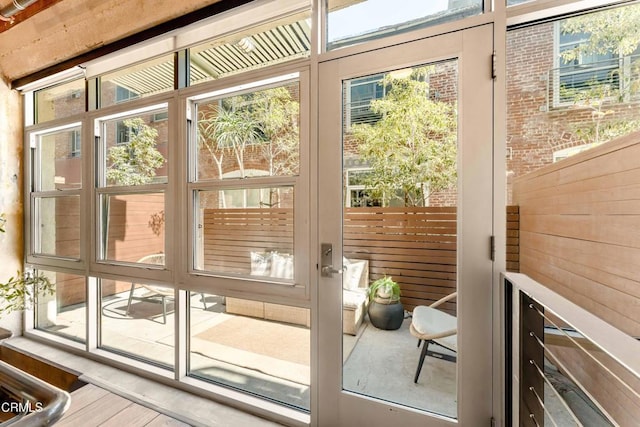 doorway to outside with hardwood / wood-style floors