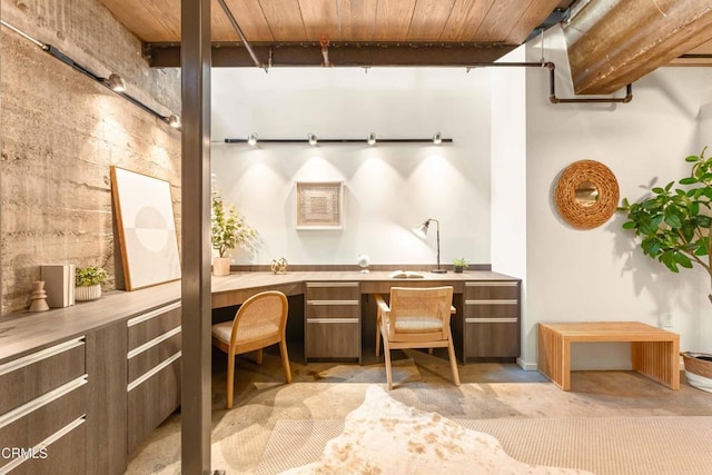 office featuring wood ceiling and built in desk