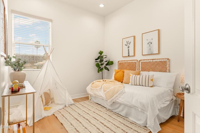 bedroom with light hardwood / wood-style floors