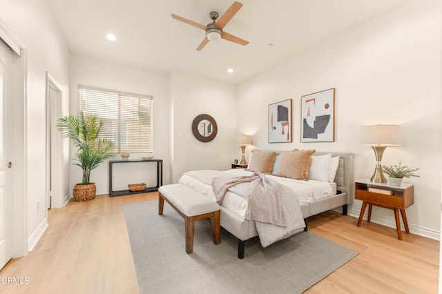 bedroom with light wood-type flooring and ceiling fan