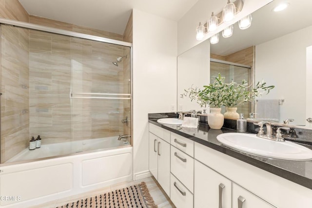 bathroom with vanity and enclosed tub / shower combo