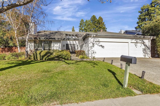 single story home with a garage and a front lawn